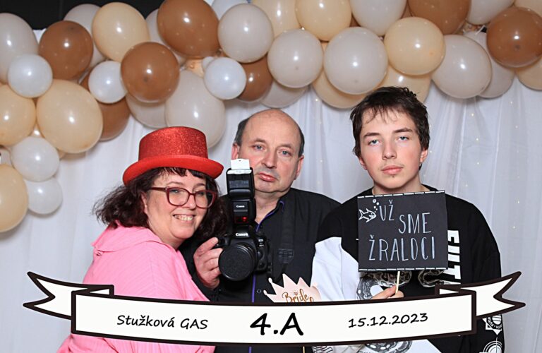 A woman in a polka dot dress holds a bag